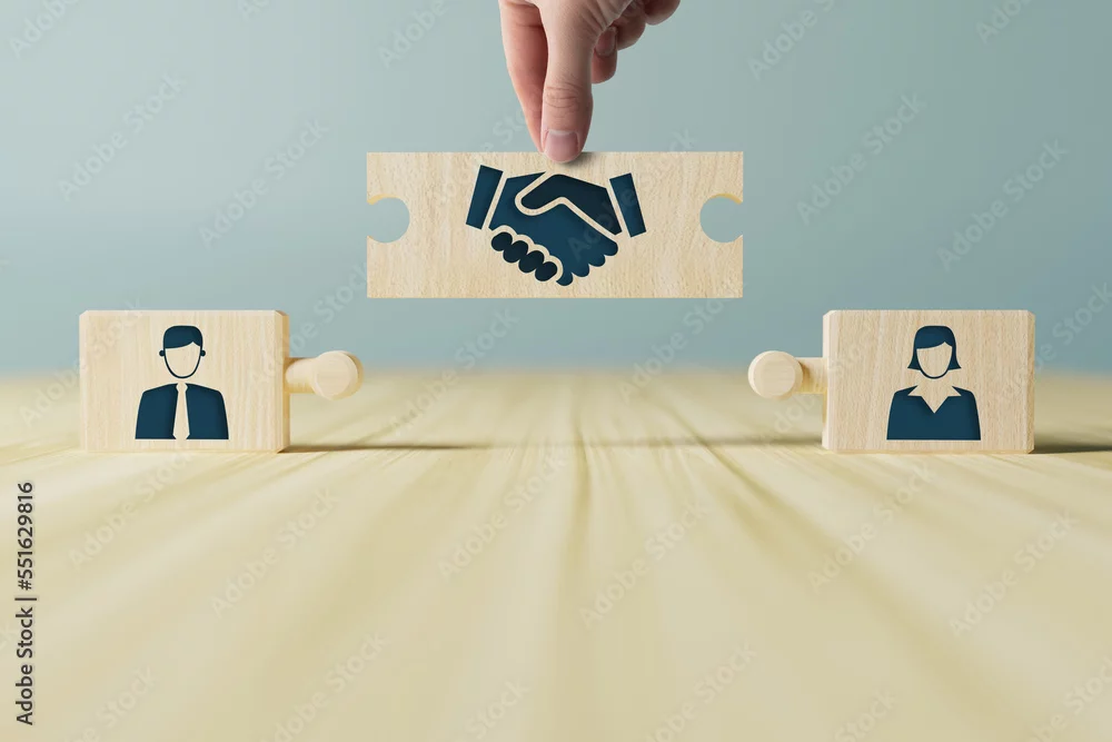 Pièces de cass-tête avec symbole de personnes se serrant les mains